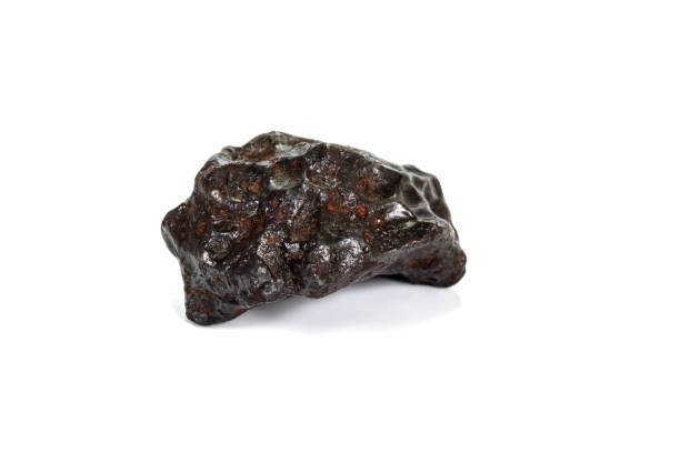 istock Macro stone mineral meteorite tektite on white background 1142674909