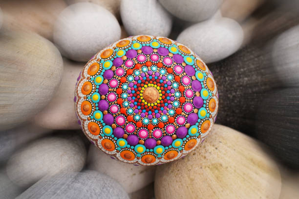 istock Beautiful mandala hand painted on a sea stone 1142675631