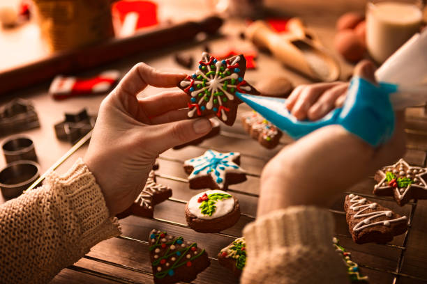 istock Colorful Christmas gingerbread cookies ornamenting 1142675971