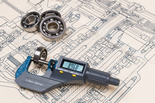 Micrometer screw gauge. Ball bearings. Drrafting. Technical drawing on background Accurate measuring tool. Digital display. Round metal parts group. Engineering draft, plan, design. Education, study. Full depth of field micrometer screw gauge stock pictures, royalty-free photos & images