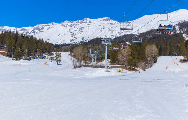 istock Skiers climb the cable car up the hill 1142681044