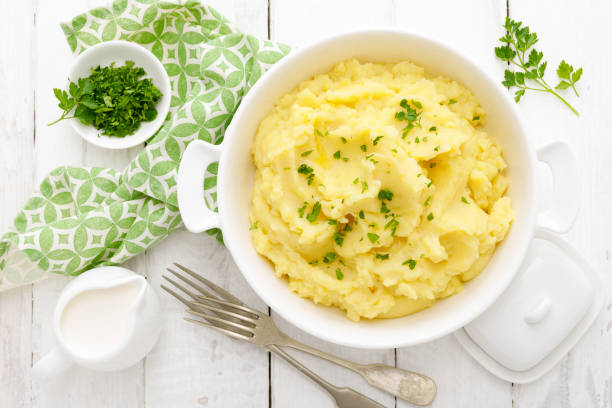 istock Mashed potato with butter and milk on table 1142681115