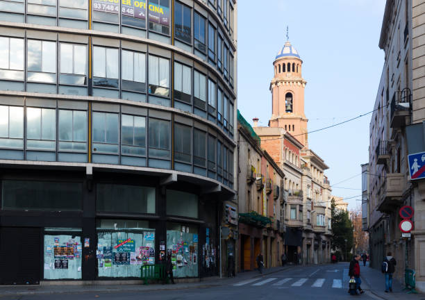 SABADELL, SPAIN - JANUARY 17, 2019: Central street of Sabadell with view of bell tower of Church of Immaculate Conception