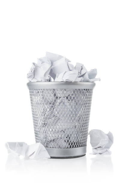 istock Waste paper in rubbish bin on white background 1142683881