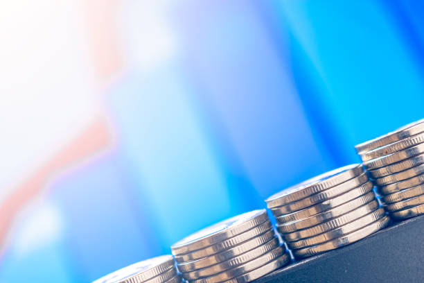 istock Online Money. coins on a laptop 1142687373