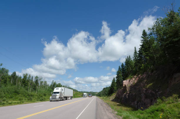 Signs on a highway in Nova Scotia warning of the maximum speed limit of 110