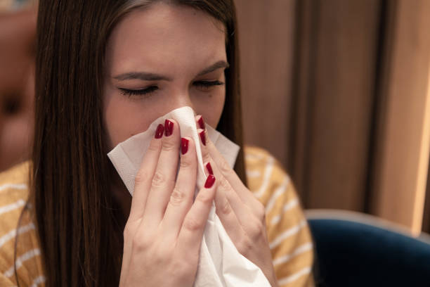 istock Woman With a Cold Blowing Nose 1142689807