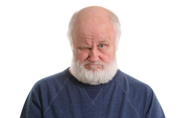 istock dissatisfied displeased old grumpy man isolated portrait 1142691823