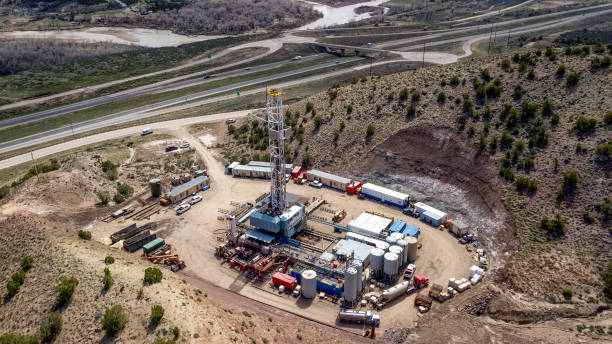Aerial Drone Clip of a Fracking Drill Rig in the Hills of Colorado in the Springtime 4K resolution of a fracking drilling rig in Colorado drill end stock pictures, royalty-free photos & images