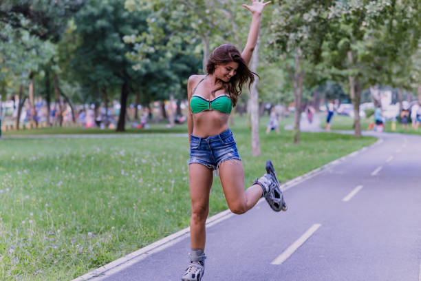 istock Woman is Having a Fun in Park on Roller Skates 1142703136