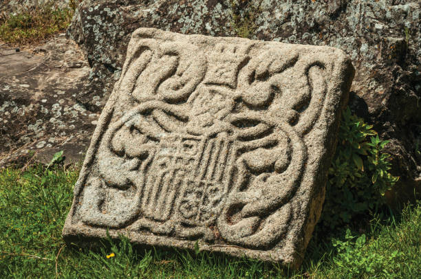 charming and shabby family coat of arms carved on stone - castelo de vide imagens e fotografias de stock