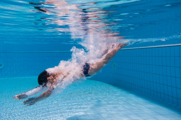 istock Boy dive in swimming pool 1142704273