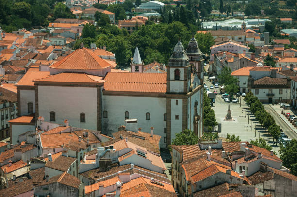 church of santa maria da devesa in front of square and roofs - castelo de vide imagens e fotografias de stock