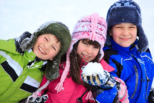 istock Happy children playing in snow 114270837
