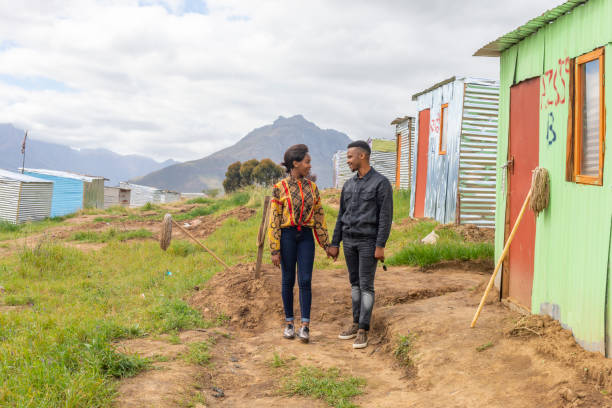 istock African Couple Walking Through a Township 1142713025
