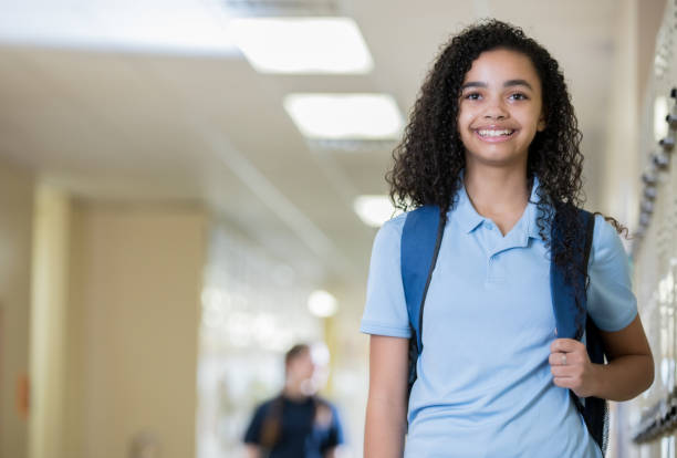 istock Teen girl holding backpack strap 1142715605