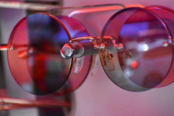 istock Iridescent sunglasses on a sales rack 1142727005