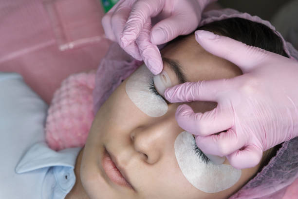 istock Eyelash Extension Procedure. Woman Eye with Long Eyelashes 1142728647