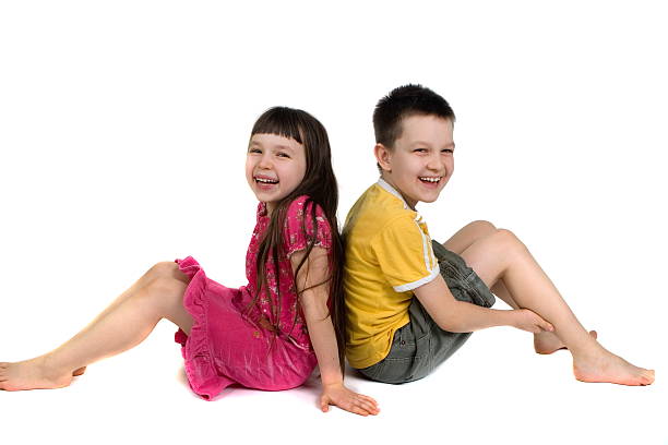 istock Happy Kids Sitting Back to Bac 114273145