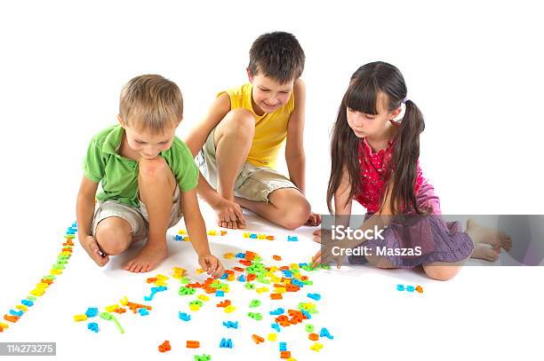 Children Playing With Letters Stock Photo - Download Image Now - Affectionate, Alphabet, Bonding