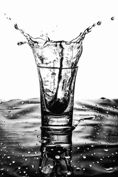 Water splashed in a shot glass.