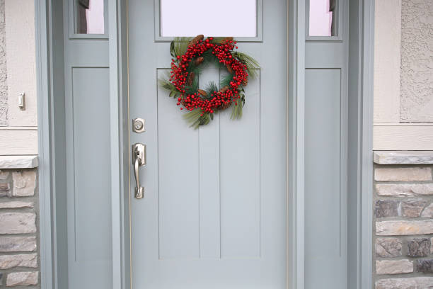 istock Beautiful Front Door Red Christmas Wreath 1142739716