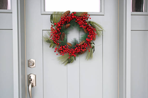 istock Beautiful Front Door Red Christmas Wreath Close Up 1142740872