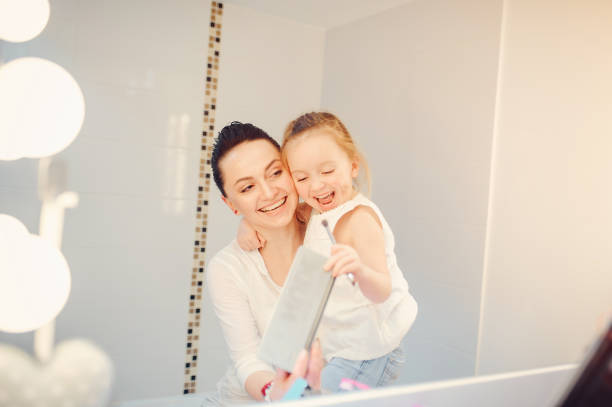 istock Cute family have fun in a bathroom 1142742337