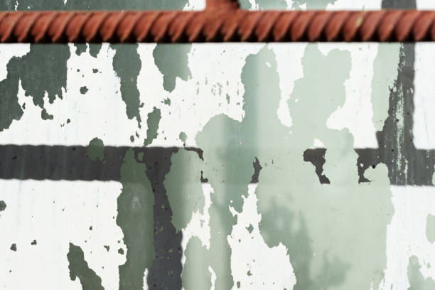 istock Old painted window behind iron bar close up. Grunge background 1142742412