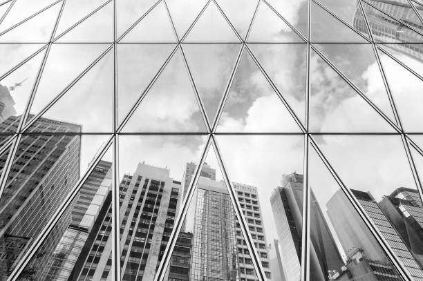istock Reflection of urban skyline on modern office building 1142742421