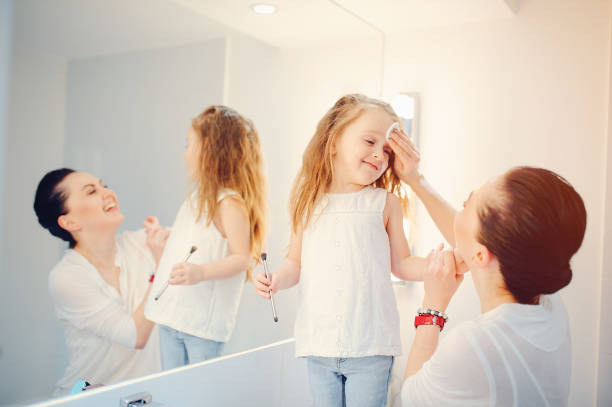 istock Cute family have fun in a bathroom 1142742427