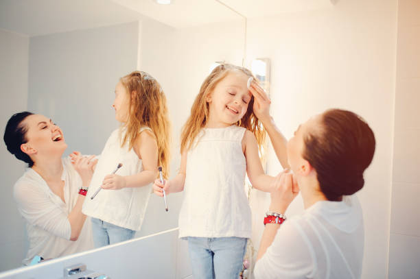 istock Cute family have fun in a bathroom 1142742430