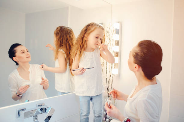 istock Cute family have fun in a bathroom 1142742436