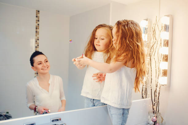 istock Cute family have fun in a bathroom 1142742451