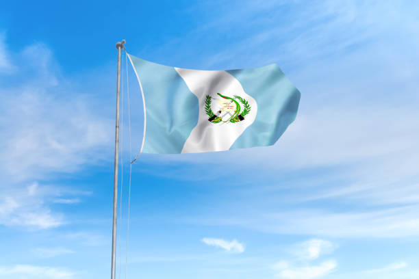 istock Guatemala flag over blue sky background 1142743811