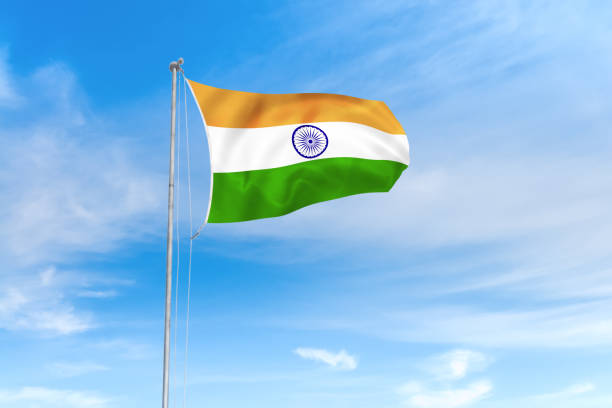 istock India flag over blue sky background 1142743817