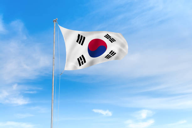 istock South Korea flag over blue sky background 1142744389