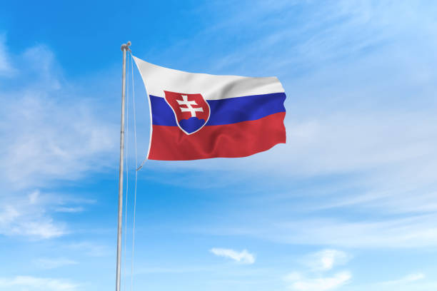istock Slovakia flag over blue sky background 1142744393