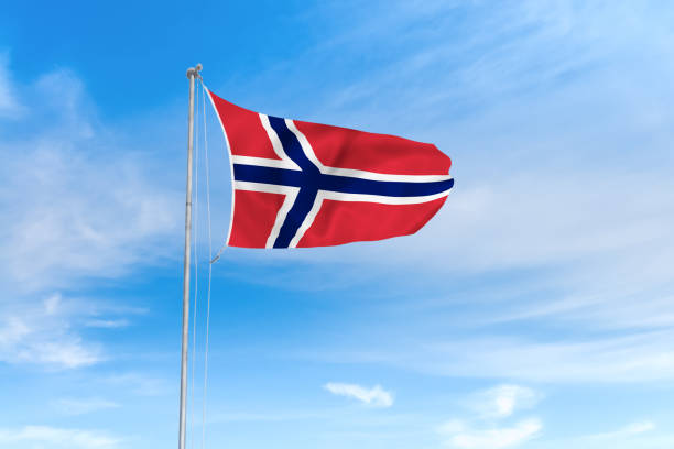 istock Norway flag over blue sky background 1142744407