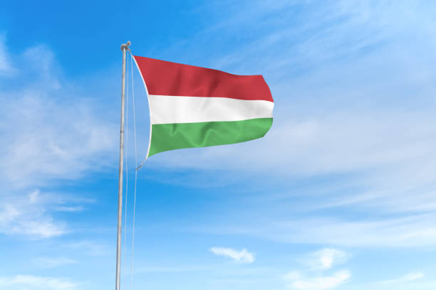 istock Hungary flag over blue sky background 1142744462