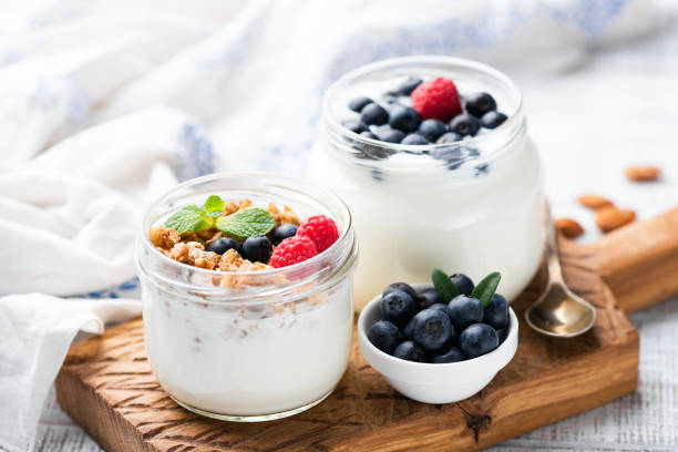 istock Natural Yogurt With Berries, Granola in Jar 1142744709