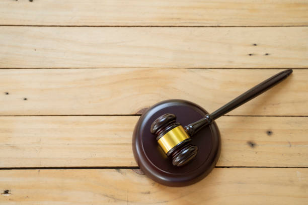 istock Hammer on the wooden table - picture 1142753021