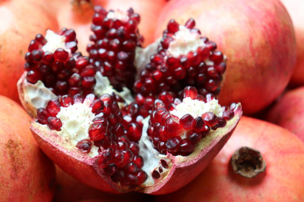 istock Red juicy pomegranates with seeds close-up 1142760066