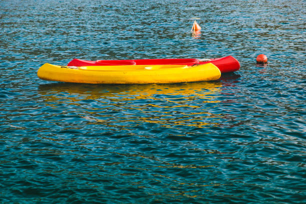 istock two kayaks red and yellow in water 1142760154