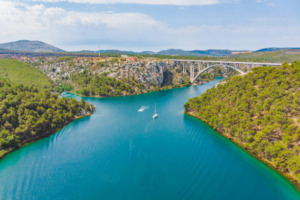 highway bridge cross river with blue water. summer time. vacation concept. boat in bay