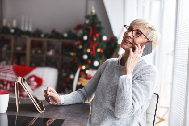 istock Senior woman enjoying while talking on the phone 1142761452