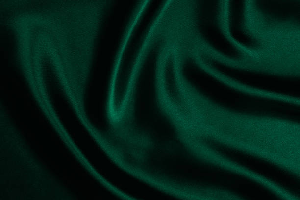 Emerald green satin background Emerald green satin background. emerald green photos stock pictures, royalty-free photos & images