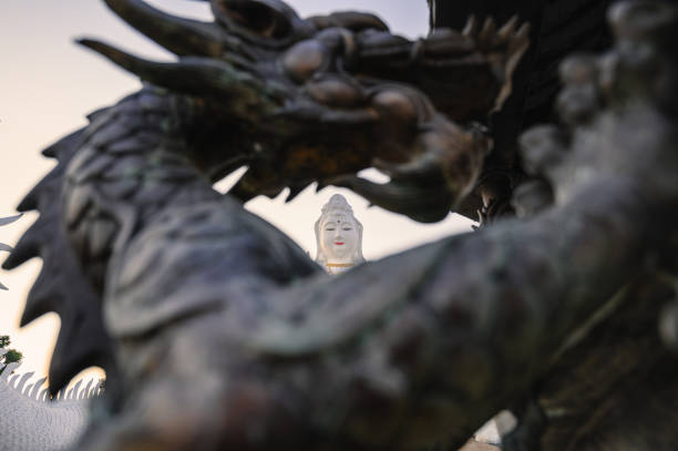 Statue guanyin through sculpture dragon in thailand temple at chiang rai