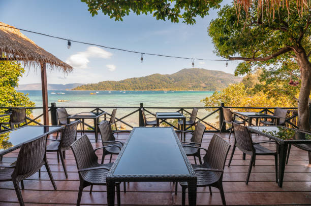 istock Dining table on terrace with beautiful tropical sea view 1142761880