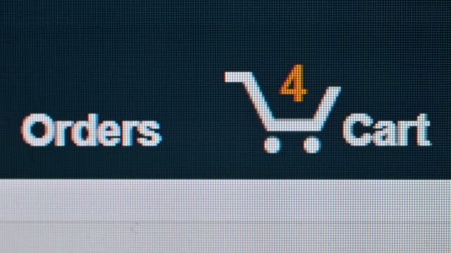 Business or technology concept : Close up macro shot of computer monitor online shopping store shopping cart been ordered.